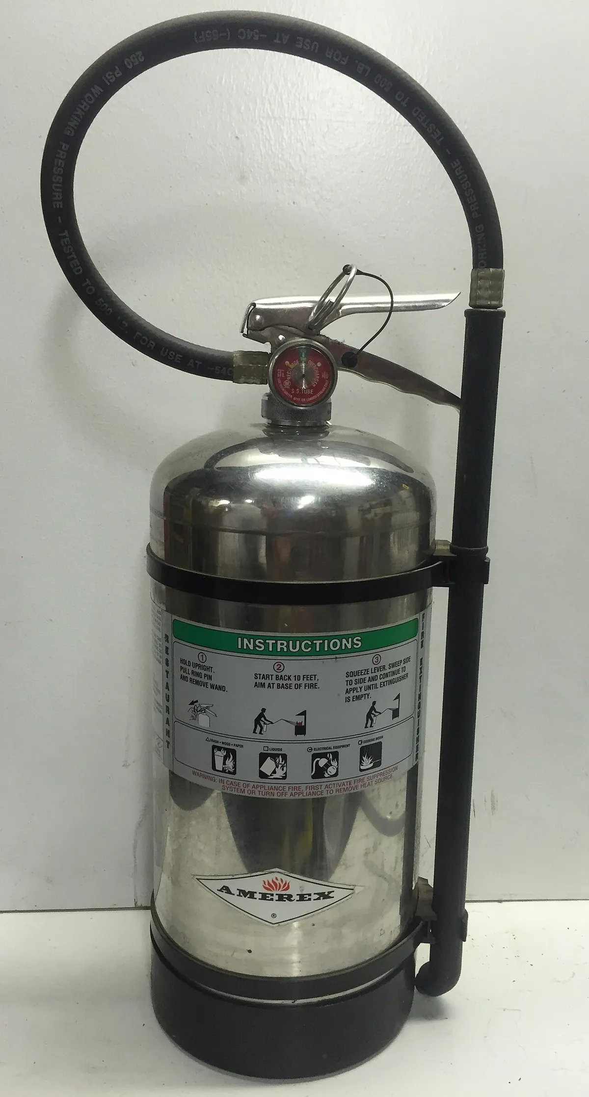 A wet chemical Class K extinguisher, part of the suppression side of a kitchen hood inspection